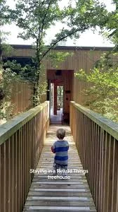 A narrow timber bridge marks the arrival.