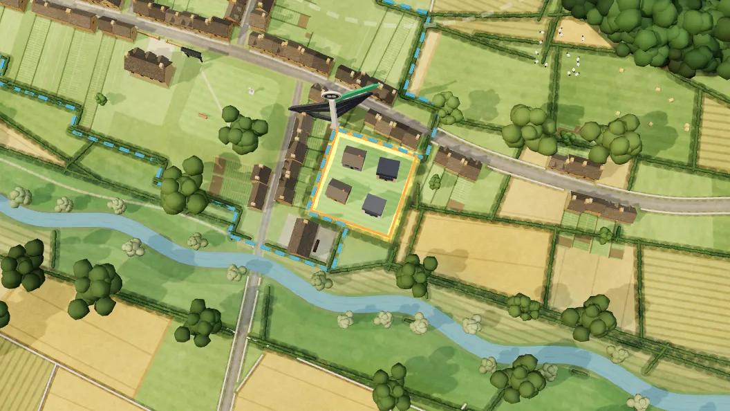 A plot outlined at the edge of a model village, between the houses and the river